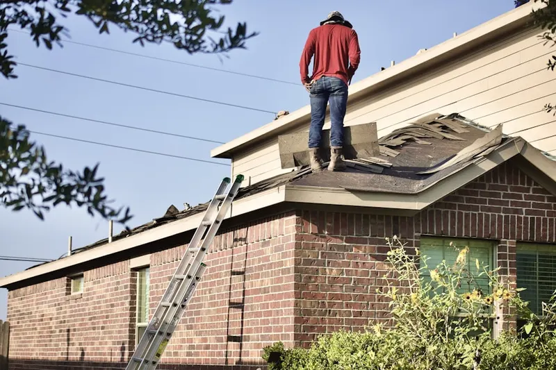 Professional roofer working on a residential roof in Downtown Tahoe City